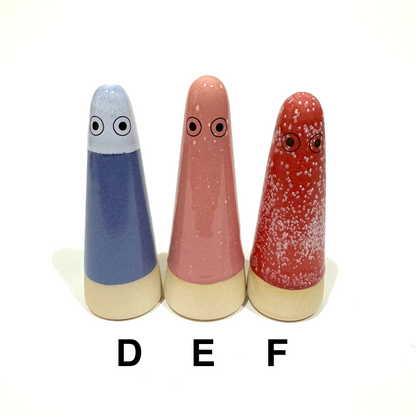 D is periwinkle top with darker blue body, E is pink with a few white spots, F is red with lots of white spots
