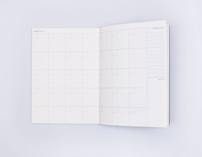Weekly & Monthly Planner Book by The Completist